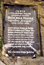 Dol - Spominska plošča gradnji ceste v Poljanski dolini